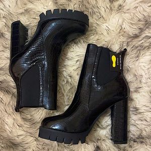 Heeled black booties
